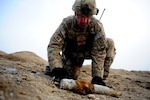 Air Force Explosive Ordnance Disposal Technician Staff Sgt. Scott Rice from the 673rd Civil Engineering Squadron, EOD flight, Joint Base Elmendorf-Richardson, Alaska, prepares to conduct a controlled detonation of unexploded ordnance March 14, 2012. Rice is deployed to the 966th Air Expeditionary Squadron EOD flight who supports Combined Joint Task Force Paladin. EOD members are experts in chemical, biological, incendiary, radiological and nuclear materials and devices. The unit helps ensure freedom of operations in a deployed environment by applying special procedures to totally remove hazards created by unexploded ordnance and improvised explosive devices.