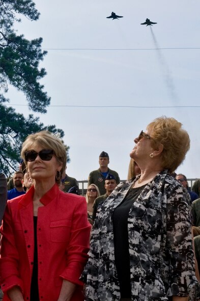 Betty Blesse, wife of retired Maj. Gen. Frederick “Boots” Blesse, watches as two F-4 Phantom IIs fly overhead during a memorial dedication ceremony, June 27, 2014, on Seymour Johnson Air Force Base, N.C. Blesse flew the Phantom II during his tour in Vietnam, he had a total of 108 combat missions and 46 sorties. (U.S. Air Force photo/Airman 1st Class Aaron J. Jenne)