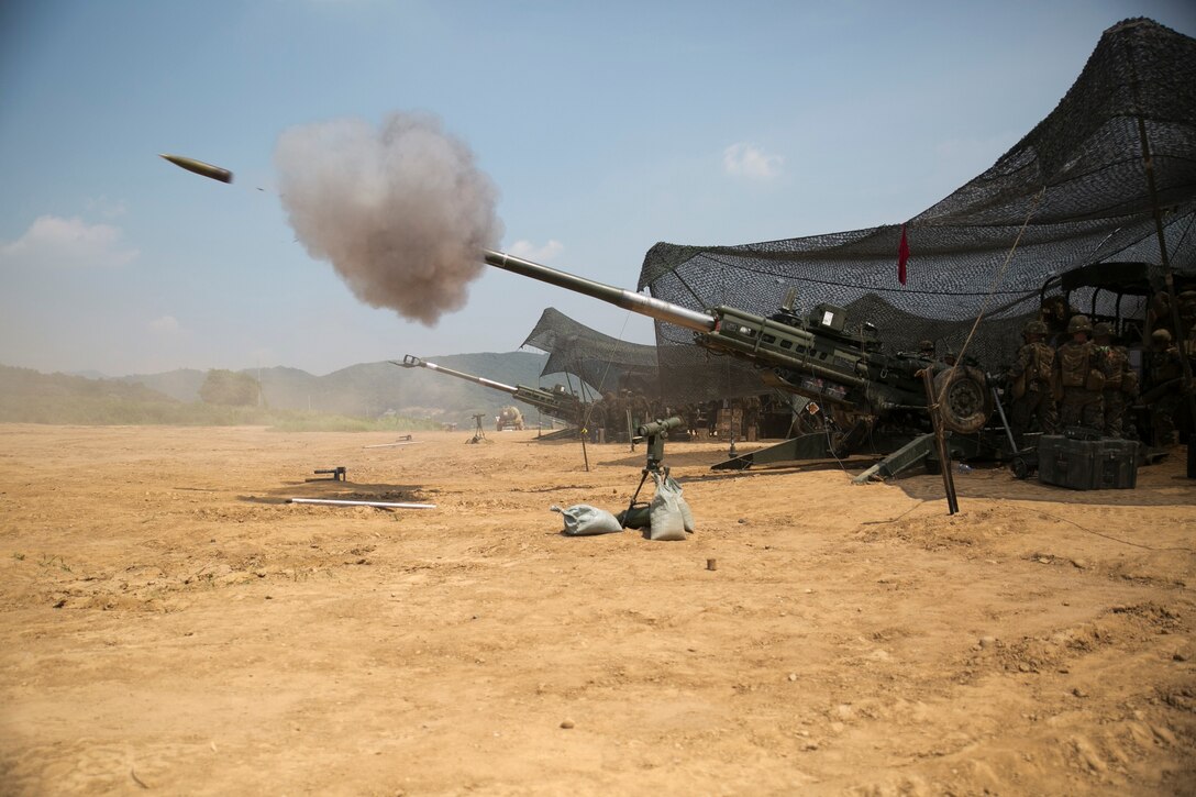 Marines fire an M777A2 lightweight 155 mm howitzers June 15 at Warrior Base, Munsan, South Korea, during Korean Marine Exchange Program 14-7. KMEP 14-7 is one iteration in a series of continuous, combined training exercises designed to enhance the ROK-U.S. alliance, promote stability on the Korean Peninsula, and strengthen the ROK-U.S. military capabilities and interoperability. The Marines are with Battery K, 3rd Battalion, 12th Marine Regiment, 3rd Marine Division, III Marine Expeditionary Force. 