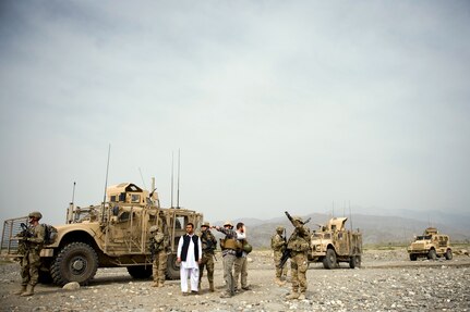 Members of the Nagarhar Agribusiness Development Team, along with members of the United States Agency for International Development, meet with the owner of a hydroelectric facility for an inspection, March 18, 2012. The mission of the agribusiness development team is to support initiatives that will ensure the sustainability of Afghan agricultural productivity.