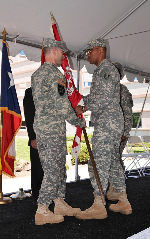 ALBUQUERQUE, N.M., -- Brig. Gen. C. David Turner (right) transfers the Corps of Engineers flag to incoming District Commander Lt. Col. Patrick Dagon signaling the transfer of command responsibility from Lt. Col. Gant to Lt. Col. Dagon, June 26, 2014. The custom of acknowledging the change in commanding officer dates back to, at least, Roman times.

