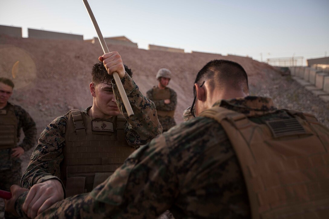 U.S. Marine Corps Cpl. John Vanderkuur, 22nd Marine Expeditionary Unit data network specialist and native of Davison, Mich., blocks and counters a forward strike during martial arts training June 27, 2014. The Marines are conducting previously scheduled sustainment training to maintain proficiency and a high degree of readiness. The 22nd MEU is deployed with the Bataan Amphibious Ready Group as a theater reserve and crisis response force throughout U.S. Central Command and the U.S. 5th Fleet area of responsibility. (U.S. Marine Corps photo by Sgt. Austin Hazard/Released)