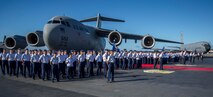 Members of the 15th Wing stand in formation on the Joint Base Pearl Harbor-Hickam flightline during the wing change of command ceremony June 27, 2014. During the ceremony, Col. Randall Huiss took command of the wing from Col. Johnny Roscoe. (U.S. Air Force photo/Tech. Sgt. Terri Paden)