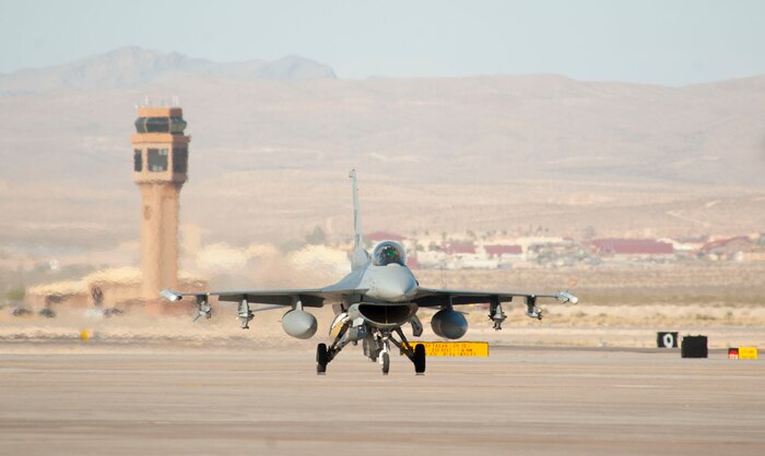 A U.S. Air Force F-16 Fighting Falcon from the 31st Fighter Wing, Aviano Air Base, Italy, taxis on the flightline during Green Flag West 14-8, June 26, 2014, at Nellis Air Force Base, Nev. The F-16 is equipped with an internal M61 Vulcan cannon, and 11 hardpoints for mounting various other weaponry and equipment. (U.S. Air Force photo by Airman 1st Class Rachel Loftis)