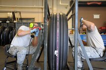 Airmen from the 2nd Maintenance Squadron wheel and tire section prepare to build a wheel setup at Barksdale Air Force Base, La., June 23, 2014. The Wheel and Tire shop maintain and inspect all of the tires used on the B-52H Stratofortress totaling more than 280 tires for both active duty and reserve aircraft. (U.S. Air Force photo/Staff Sgt. Jason McCasland)