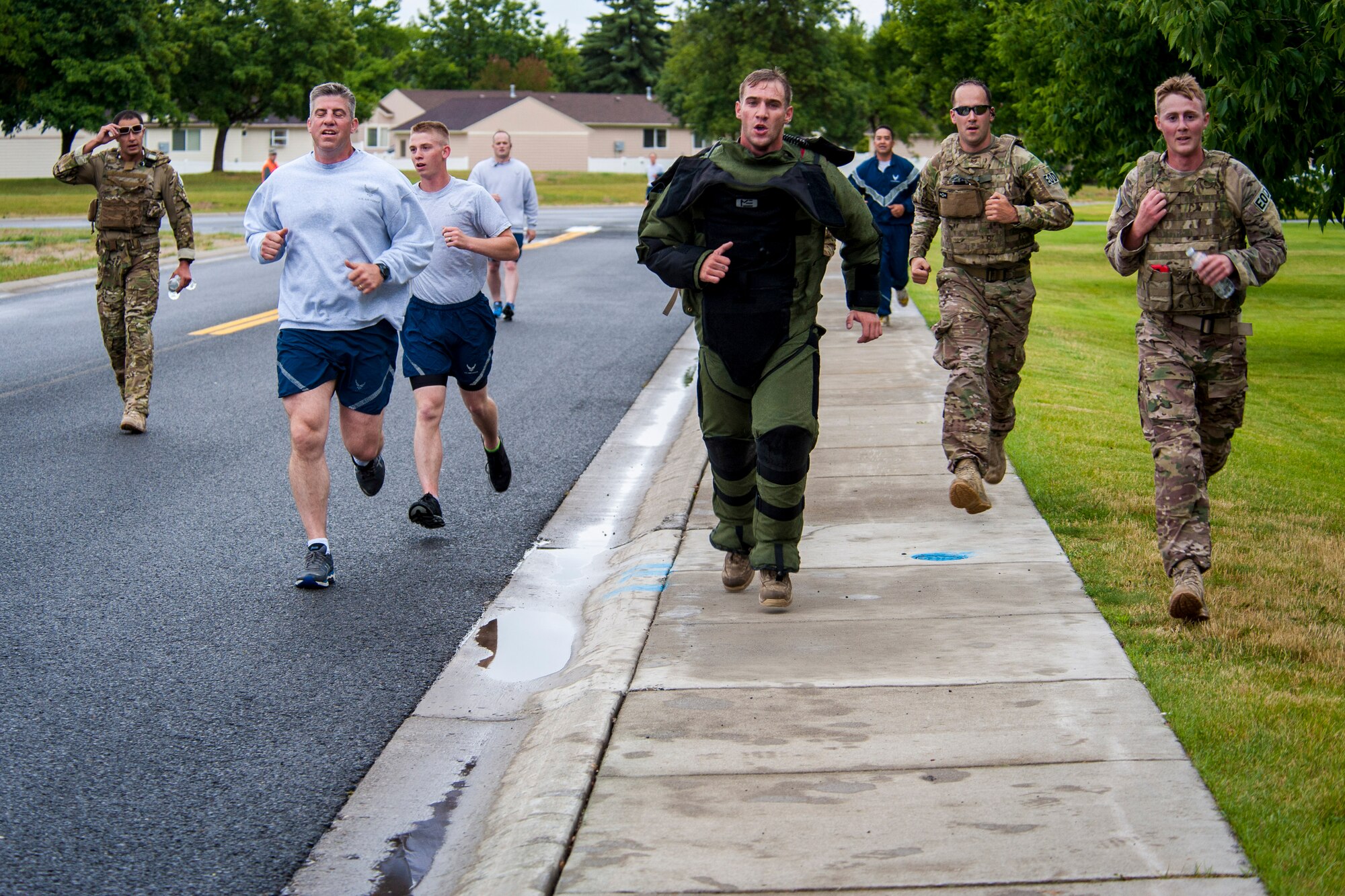 Explosive ordnance disposal Airmen from the 92nd Civil Engineer Squadron participate in a monthly wing run in honor of fallen comrade, Tech. Sgt. Daniel Doville, at Fairchild Air Force Base, Washington, June 27, 2014. Wing runs allow Airmen to personally assess their physical fitness and enhance unit cohesion through team morale and welfare. Doville was killed in action by an improvised explosive device on June 26, 2011, while serving overseas. Many of Fairchild’s EOD Airmen knew him personally and have since decided to run in his honor. (U.S. Air Force photo by Staff Sgt. Benjamin W. Stratton/Released)