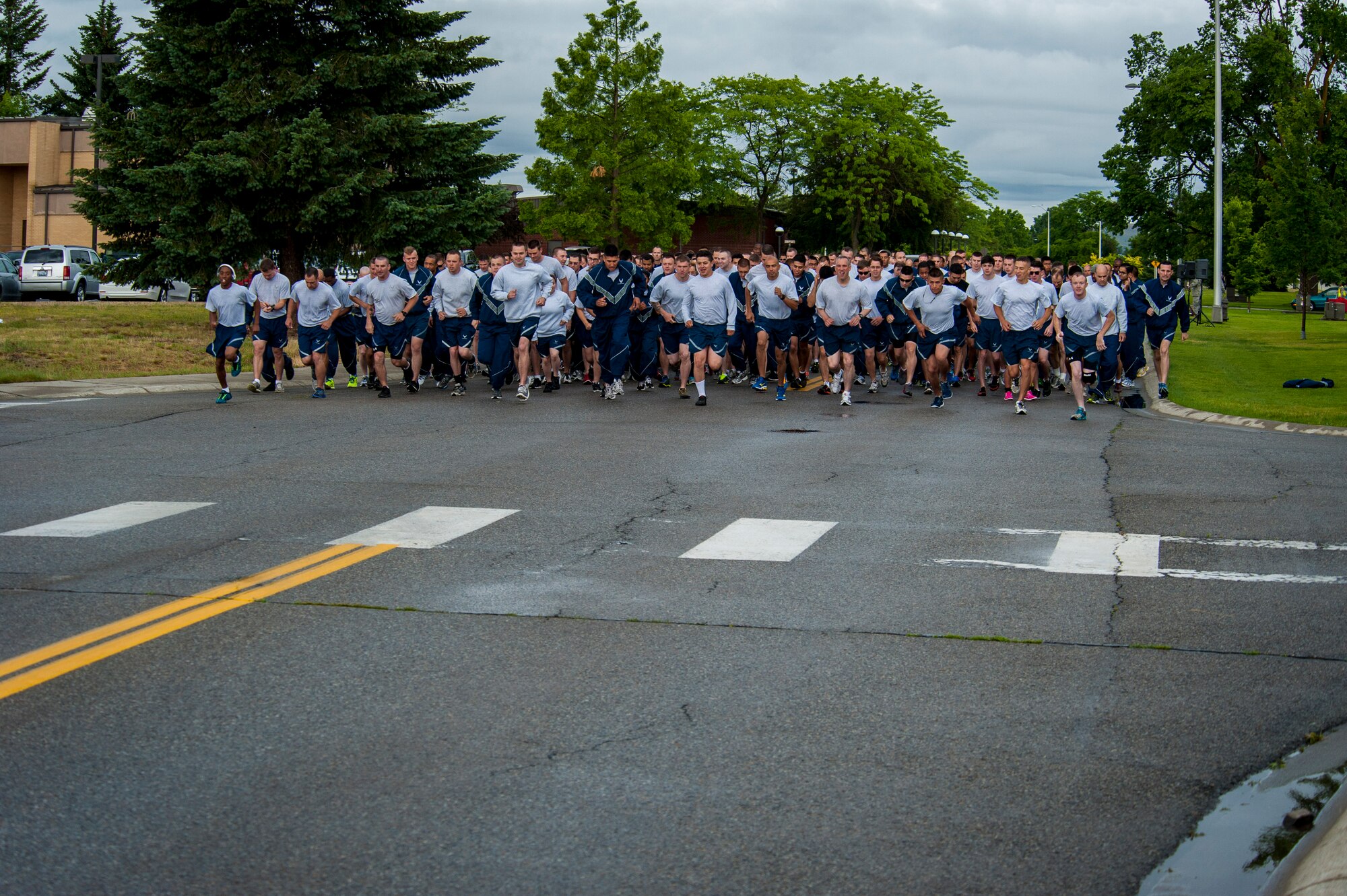 Fairchild Airmen participate in a monthly wing run at Fairchild Air Force Base, Washington, June 27, 2014. Wing runs allow Airmen to personally assess their physical fitness and enhance unit cohesion through team morale and welfare. (U.S. Air Force photo by Staff Sgt. Benjamin W. Stratton/Released)