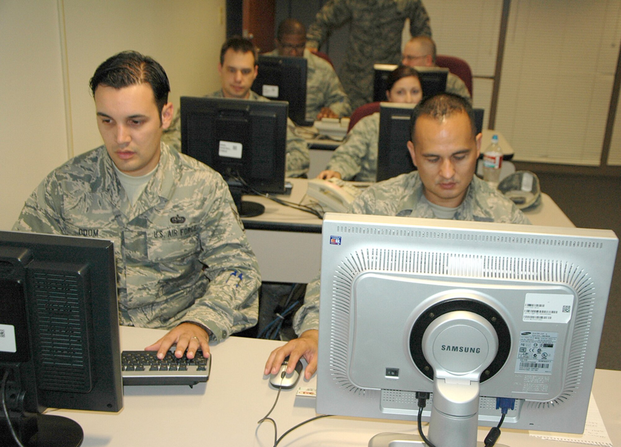 Reserve Airmen from the 23rd Combat Communications Squadron, Travis Air Force Base, California and one from Niagara Falls, New York, were at Joint Base Lewis-McChord, Washington in June to help the active-duty 627th Communications Squadron here prepare for a Command Cyber Readiness Inspection.  (U.S. Air Force Reserve photo by Sandra Pishner)