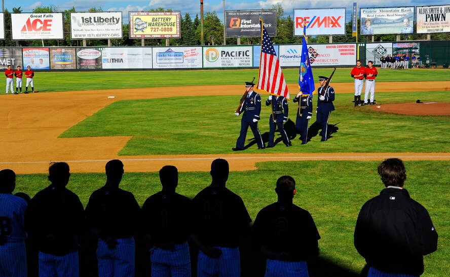 Members of Malmstrom’s Honor Guard post the colors during The National Anthem at the Great Falls Voyagers vs the Missoula Osprey game during military appreciation night at Centene Stadium in Great Falls on June 28. More than 3,000 military members, veterans and civilians were in attendance. (U.S. Air Force photo/Airman 1st Class Collin Schmidt)