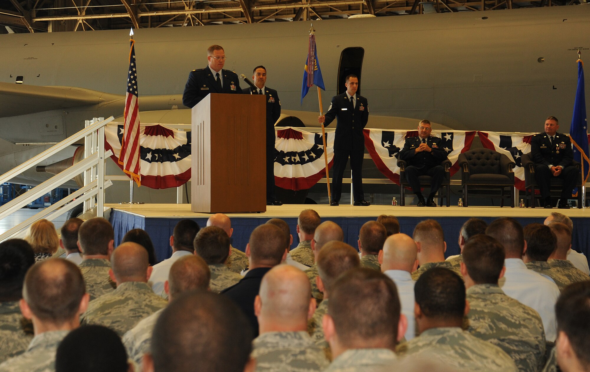 Maj. Leonard Shores talks with members of the 92nd Maintenance Squadron during their change of command at Fairchild Air Force Base, Washington, June 30, 2014. Shores is the new 92nd MXS commander. A change of command is a military tradition that represents a formal transfer of responsibility for a unit from one commanding officer to another. (U.S. Air Force photo by Staff Sgt. Samantha Krolikowski/Released) 