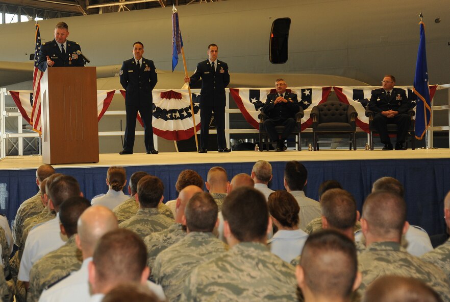 Maj. Sean Goode talks with members of the 92nd Maintenance Squadron during a change of command ceremony at Fairchild Air Force Base, Washington, June 30, 2014. Goode was the 92nd Maintenance Squadron commander. A change of command is a military tradition that represents a formal transfer of responsibility for a unit from one commanding officer to another. (U.S. Air Force photo by Staff Sgt. Samantha Krolikowski/Released)