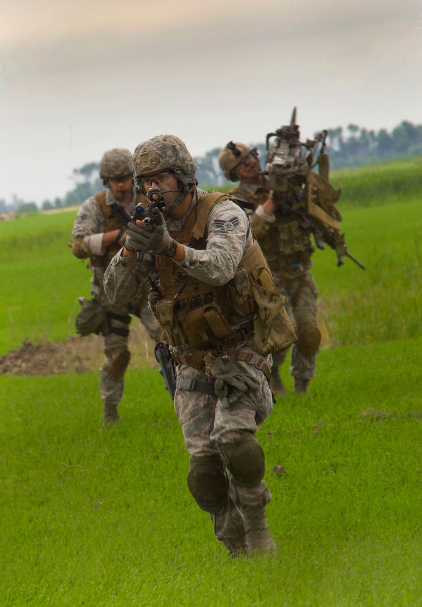 Tactical Response Force members approach a launch facility during a recapture, recovery exercise in North Dakota, June 26, 2014. The exercise is to evaluate the response of infield forces to an attack at a simulated breached site. (U.S. Air Force photo/Senior Airman Brittany Y. Bateman)