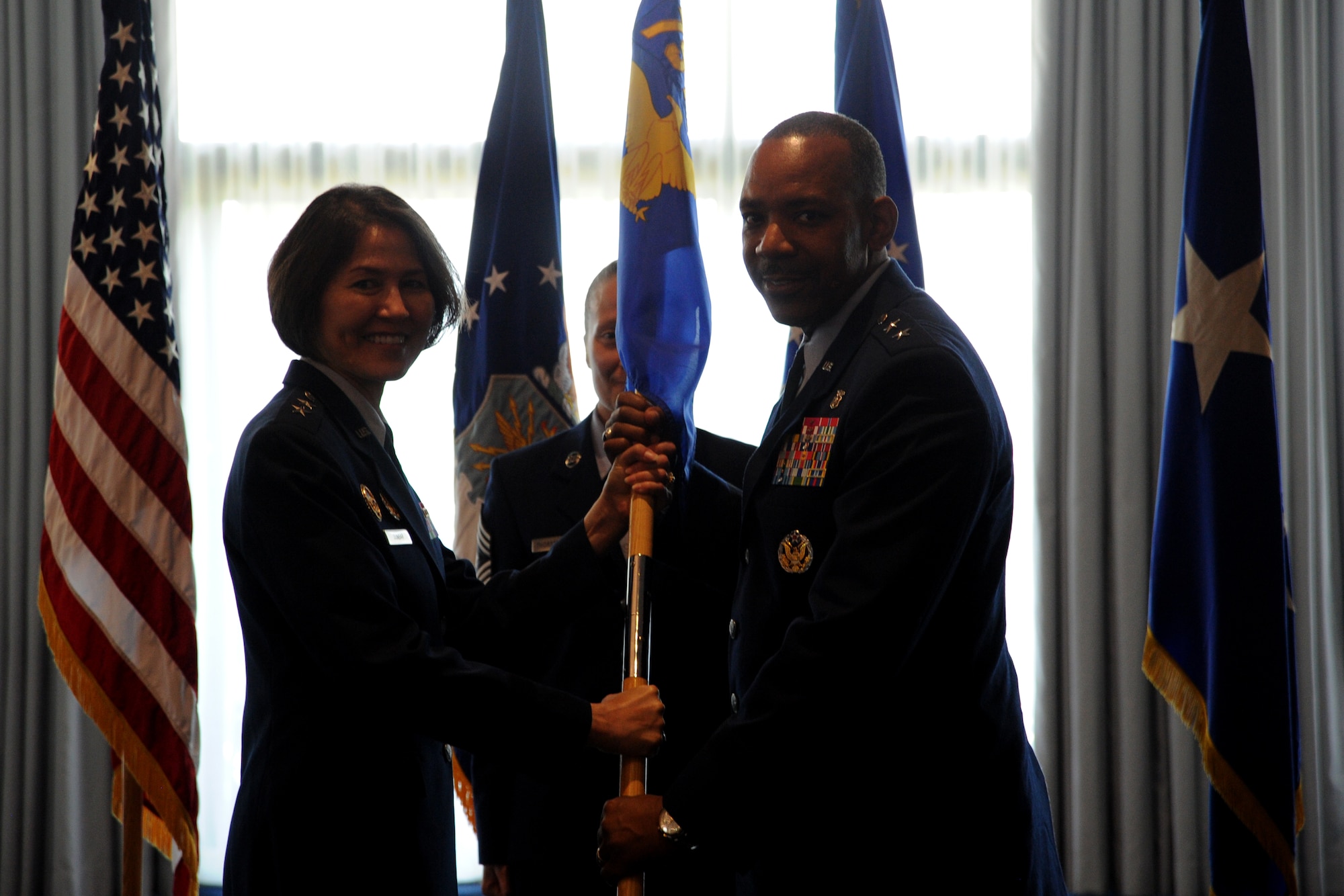 Maj. Gen. (Dr.) Roosevelt Allen assumes command of the 79th Medical Wing from Air Force District of Washington Commander Maj. Gen. Sharon K. G. Dunbar during a ceremony at Joint Base Anacostia-Bolling, Washington, D.C., June 30, 2014. The 79th MDW was activated May 12, 2006. It is one of three medical wings in the Air Force. (U.S. Air Force photo/Master Sgt. Tammie Moore)