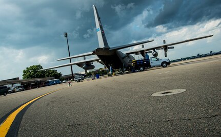 An Air Force Reserve C-130 aircrew assigned to the 910th Airlift Wing, Youngstown Air Reserve Station, Ohio, prepare for a spraying mission June 25, 2014, at Joint Base Charleston, S.C. The C-130 Hercules and crew sprayed for mosquitos on JB Charleston and is the only unit of its kind in the Air Force.  (U.S. Air Force photo/Airman 1st Class Clayton Cupit)