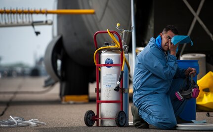 An Airman from the 910th Airlift Wing, Youngstown Air Reserve Station, Ohio, wipes his face after removing his gas mask June 25, 2014, at Joint Base Charleston, S.C. The C-130 Hercules and crew sprayed for mosquitos on JB Charleston and is the only unit of its kind in the Air Force. (U.S. Air Force photo/Airman 1st Class Clayton Cupit)