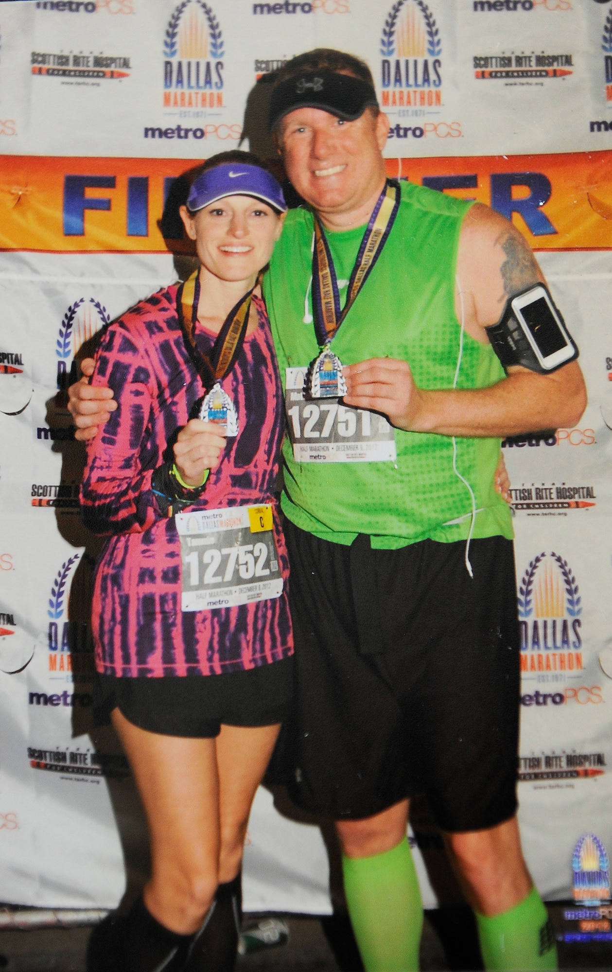 Senior Master Sgt. Tammy Gaudu, 460th Space Communication Squadron operations flight chief, poses with her husband after finishing a half-marathon in 2012. Gaudu is training to run in the Air Force Marathon as part of the Air Force Space Command team. (Courtesy photo) 