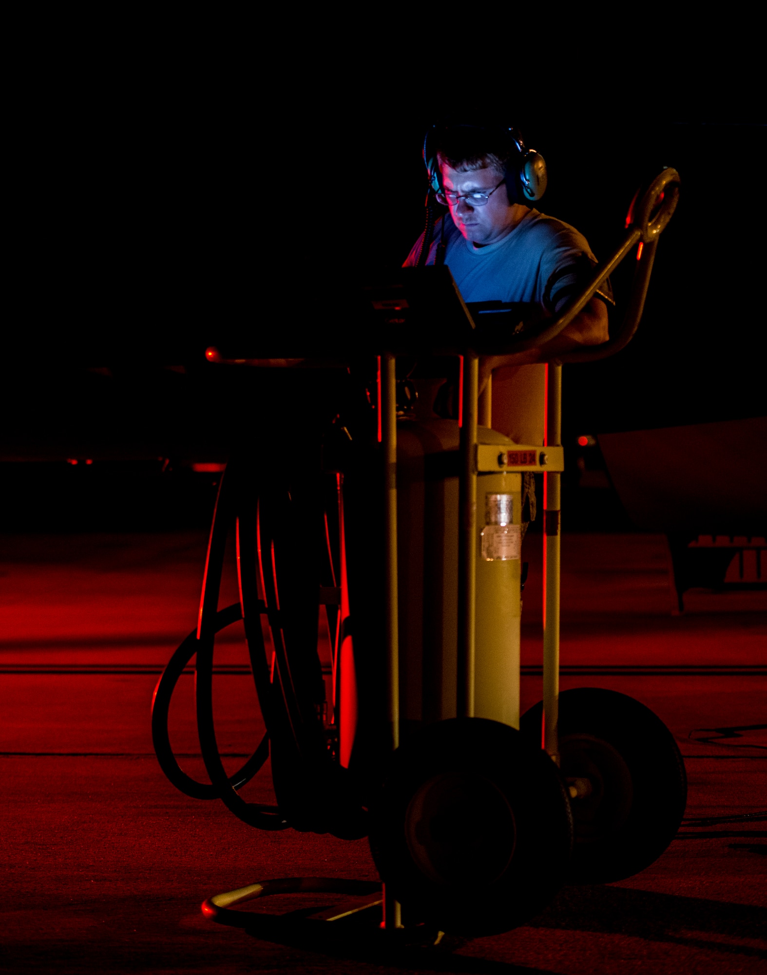 A 437th Airlift Wing maintainer performs routine maintenance and system checks on a C-17 Globemaster III June 25, 2014, at Joint Base Charleston, S.C. The maintainers perform checks and maintenance around the clock to ensure the aircraft are ready to fly. (U.S. Air Force photo/ Airman 1st Class Clayton Cupit) 