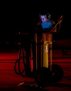 A 437th Airlift Wing maintainer performs routine maintenance and system checks on a C-17 Globemaster III June 25, 2014, at Joint Base Charleston, S.C. The maintainers perform checks and maintenance around the clock to ensure the aircraft are ready to fly. (U.S. Air Force photo/ Airman 1st Class Clayton Cupit) 