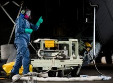 An Airman from the 910th Airlift Wing, Youngstown Air Reserve Station, Ohio, gives a “thumbs up” to an Airman to begin transferring insecticide to a C-130 Hercules June 25, 2014, at Joint Base Charleston, South Carolina. The spray crew was in Charleston to spray for mosquitos on JB Charleston and is the only unit of its kind in the Air Force. (U.S. Air Force photo/Senior Airman Dennis Sloan) 

