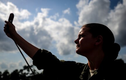 Maj. Jen Remmers, 910th Airlift Wing, Youngstown Air Reserve Station, Ohio, checks the wind speed June 25, 2014, at Joint Base Charleston, S.C. The C-130 Hercules and crew sprayed for mosquitos on JB Charleston and is the only unit of its kind in the Air Force.  (U.S. Air Force photo/Senior Airman Dennis Sloan)