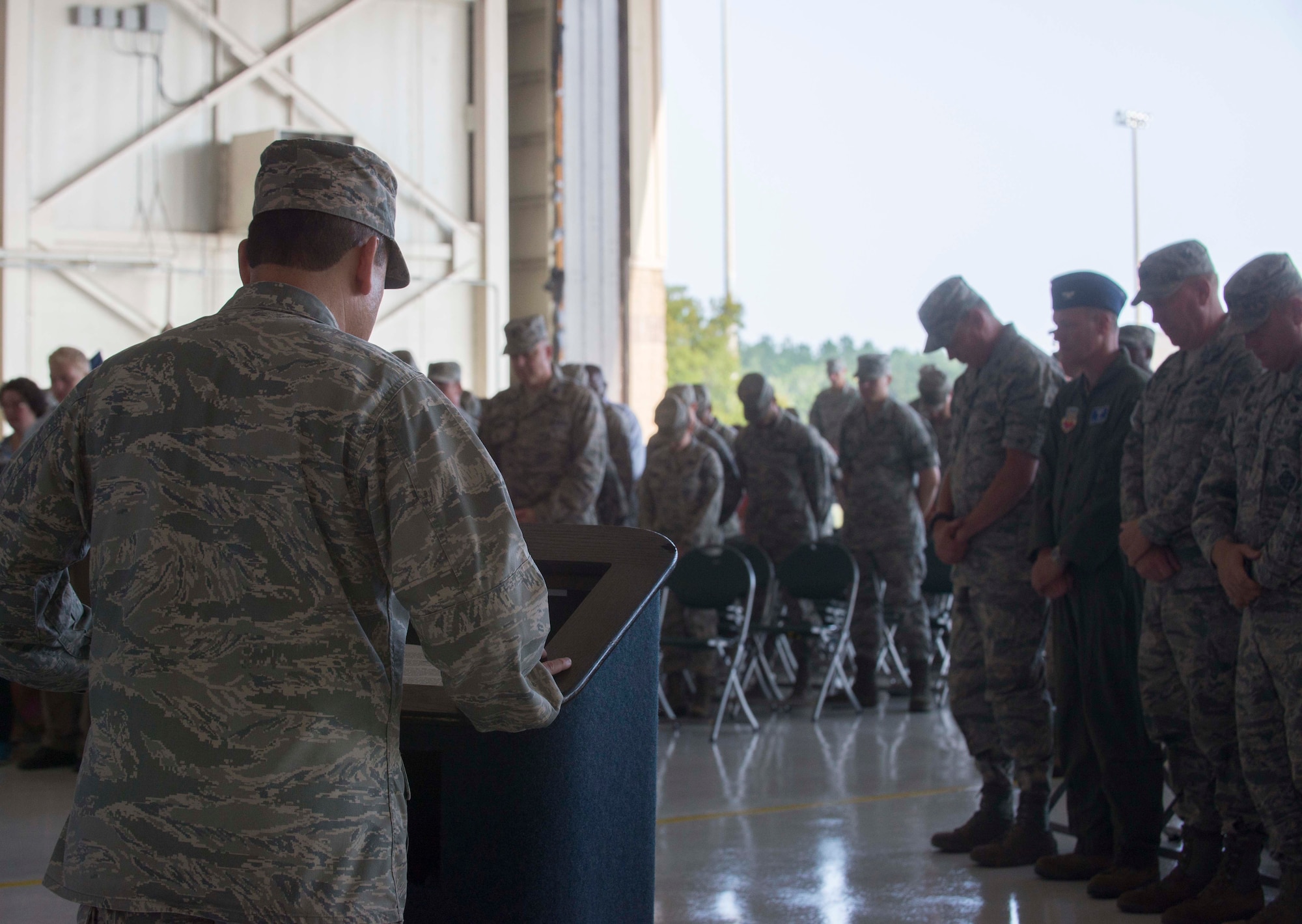 U.S. Air Force Chaplain (Maj.) Ismael Rodriguez, 23d Wing chapel, gives the invocation during the 23d Medical Group change of command ceremony June 30, 2014, at Moody Air Force Base, Ga. The 23d Medical Group change of command ceremony is a military tradition to signify the transfer of authority from one commander to the next. (U.S. Air Force photo by Airman Dillian Bamman/Released)