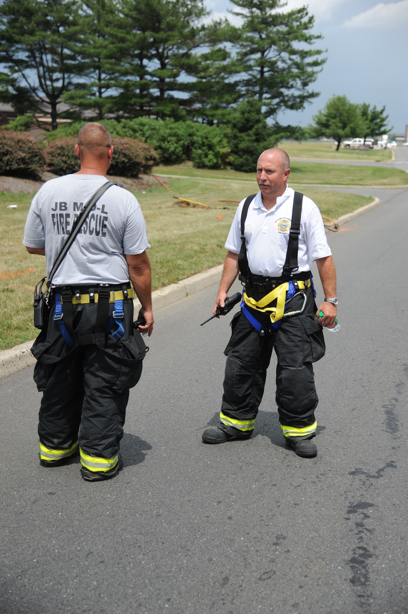 Firefighters cordon the scene of a broken gas line June 25, 2014, at Joint Base McGuire-Dix-Lakehurst, N.J. Firefighters, emergency management personnel and security forces teamed up after arriving on scene and defused the situation by shutting the gas off, evacuating the nearest building and setting up an alternate traffic route. (U.S. Air Force photo by Airman 1st Class Sean M. Crowe/Released)