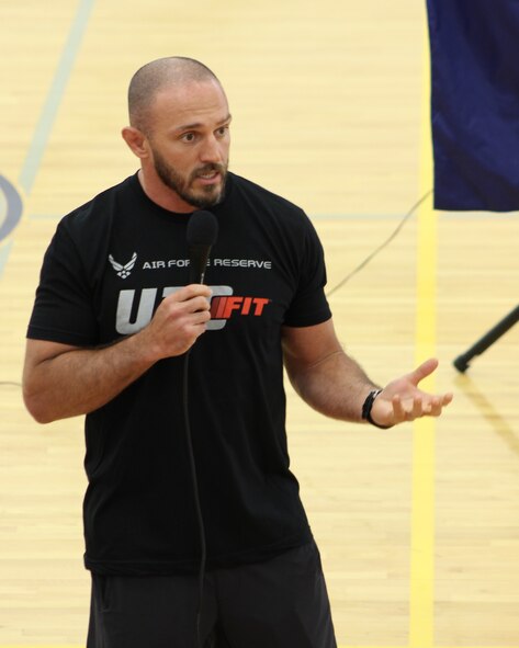 Mike Dolce, Ultimate Fighting Championship coach, talks to Team Dover Airmen and civilian personnel on the importance of a healthy and active lifestyle June 26, 2014, at the fitness center on Dover Air Force Base, Del. Dolce visited Dover AFB on a stop of the 2014 UFC Fit Tour (U.S. Air Force photo/Herbert E. Welday III)