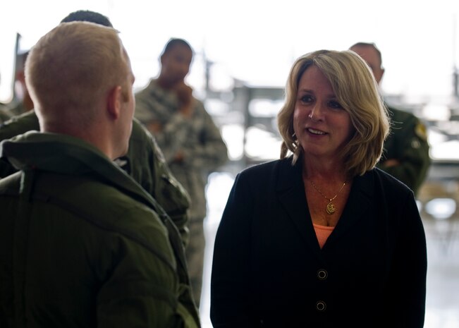 Secretary of the Air Force Deborah Lee James, speaks to Capt. Brad Matherne, 53rd Test Management Group pilot, during a visit June 20, 2014, at Nellis Air Force Base, Nev.  James was here to visit the men and women of Nellis and Creech AFB, and to participate in the United States Air Force Weapons School advanced integration phase for class 14-A. (U.S. Air Force photo by Senior Airman Jason Couillard)