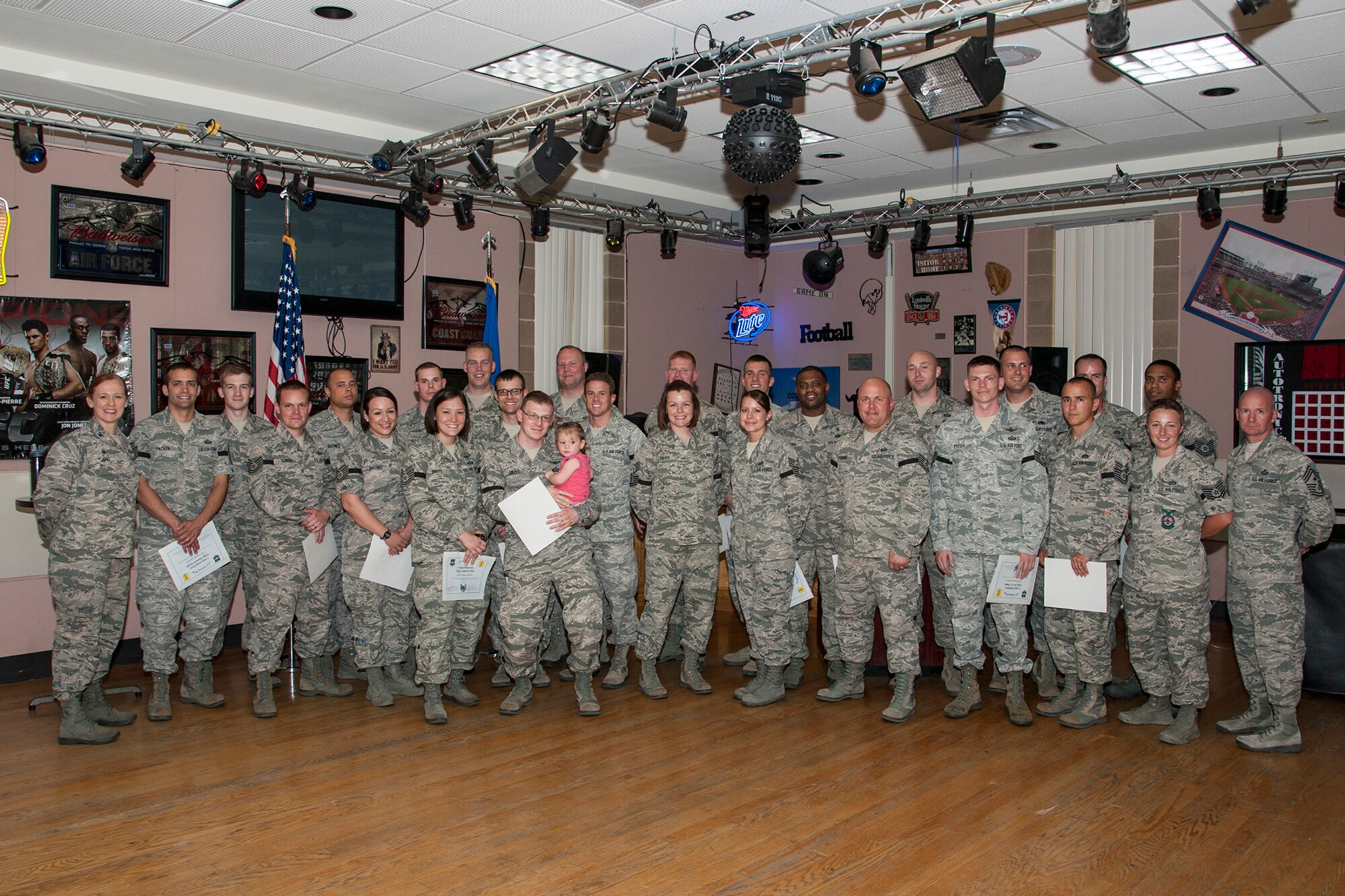 GOODFELLOW AIR FORCE BASE, Texas – Technical sergeant selects pose with the 17th Training Wing leadership for a photo during the Technical Sergeant Promotion Release Party at the Event Center June 27. (U.S. Air Force photo/ Senior Airman Michael Smith)
