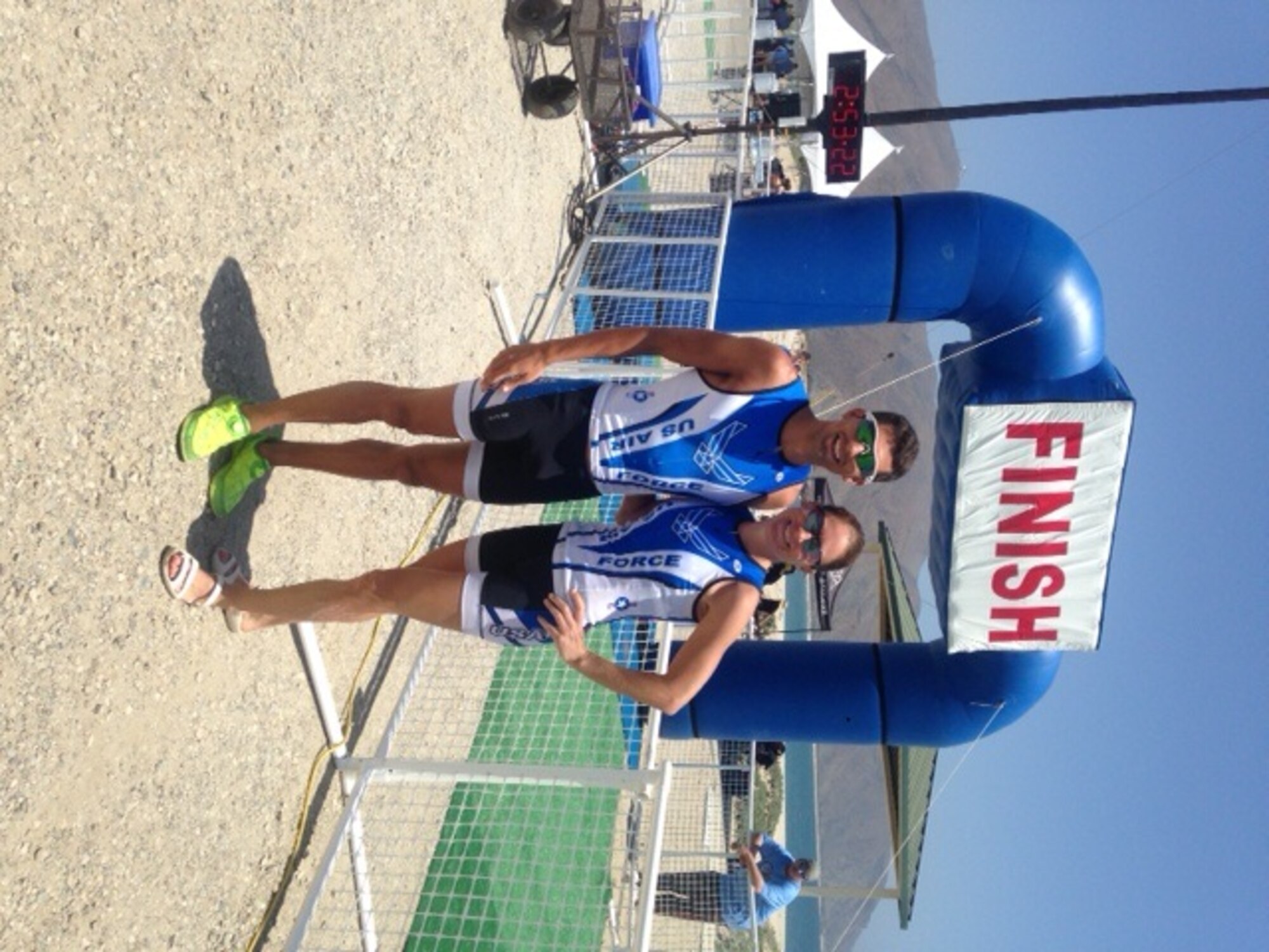 Capt. Jamie Turner, 315th Airlift Wing C-17 pilot and Capt. Brett King, 17th Airlift Squadron pilot pose for a photo after competing in 4th annual Armed Forces Triathlon Championships, at Naval Base Ventura County, Point Mugu Calif., May 30, 2014. 