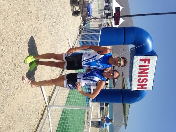 Capt. Jamie Turner, 315th Airlift Wing C-17 pilot and Capt. Brett King, 17th Airlift Squadron pilot pose for a photo after competing in 4th annual Armed Forces Triathlon Championships, at Naval Base Ventura County, Point Mugu Calif., May 30, 2014. 