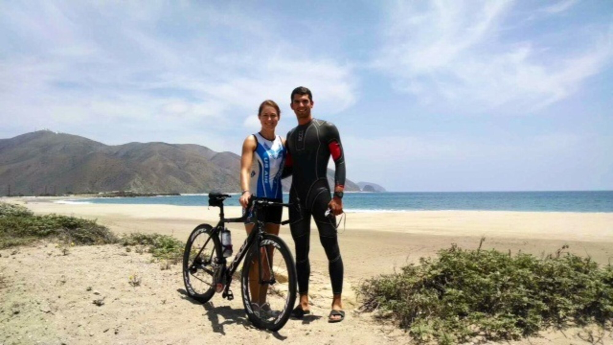 Capt. Jamie Turner, 315th Airlift Wing C-17 pilot and Capt. Brett King, 17th Airlift Squadron pilot stop to take in the view on a training ride at Naval Base Ventura County, Point Mugu Calif., May 30, 2014. Turner and King represented the Air Force at the 4th annual Armed Forces Triathlon Championships. 