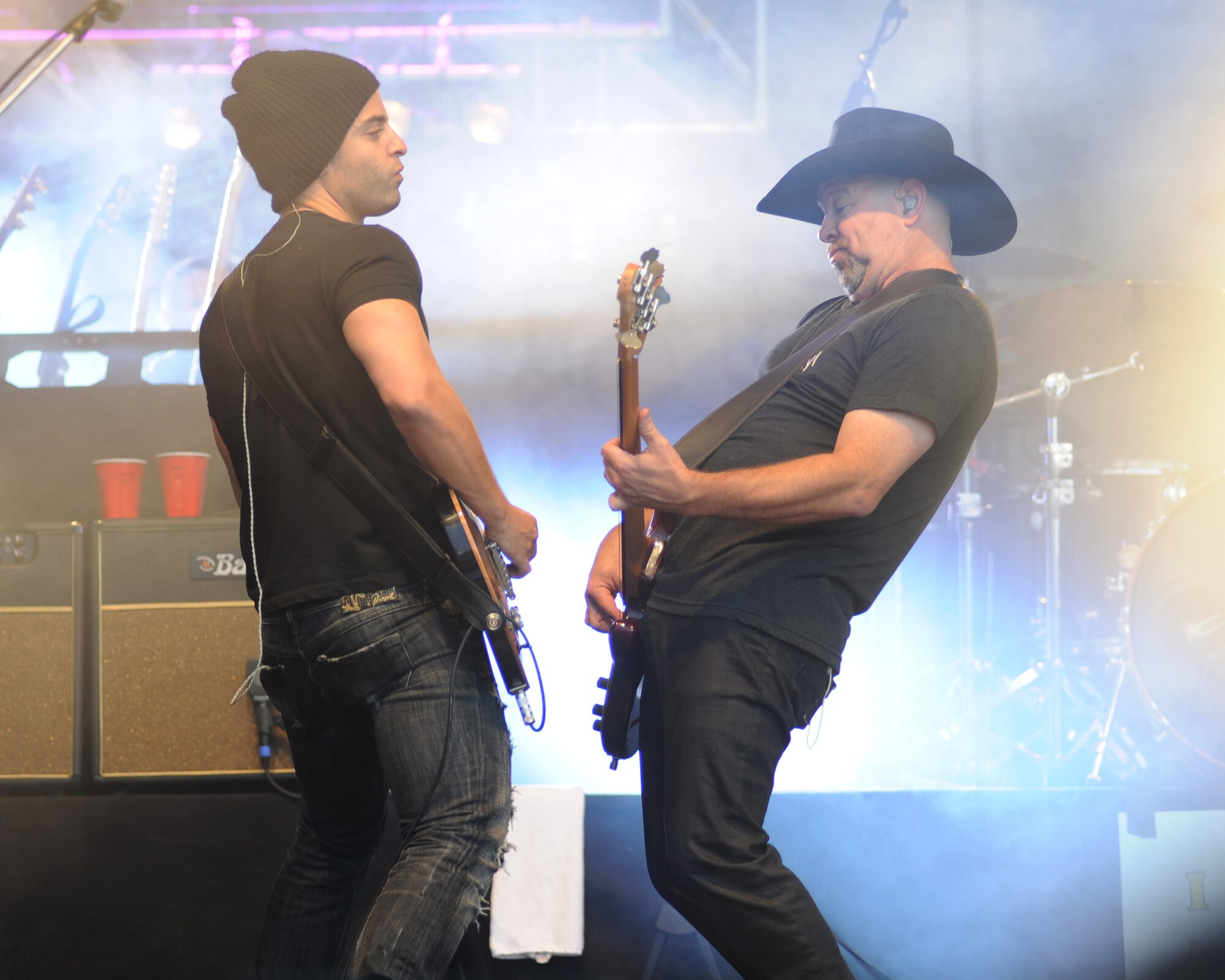 Members of musician David Cook’s band play guitars during a performance at the Skeleton Memorial Fitness Center June 29, 2014, at Spangdahlem Air Base, Germany. Navy and Armed Forces Entertainment sponsored the concert as part of a worldwide tour for service members and their families (U.S. Air Force photo by Airman 1st Class Dylan Nuckolls/Released)