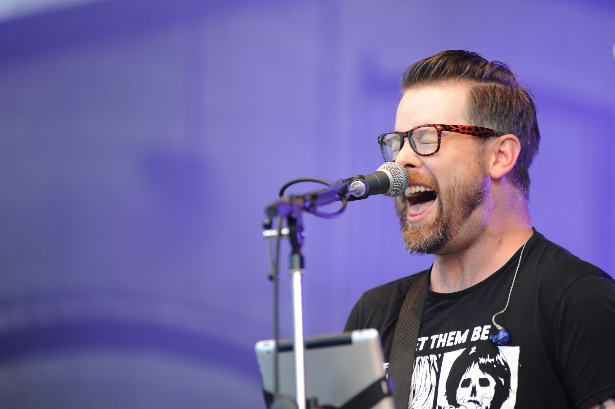 Musician David Cook performs at the Skeleton Memorial Fitness Center June 29, 2014, at Spangdahlem Air Base, Germany. More than 200 Sabers attended the 2008 American Idol winner’s concert. (U.S. Air Force photo by Airman 1st Class Dylan Nuckolls/Released)