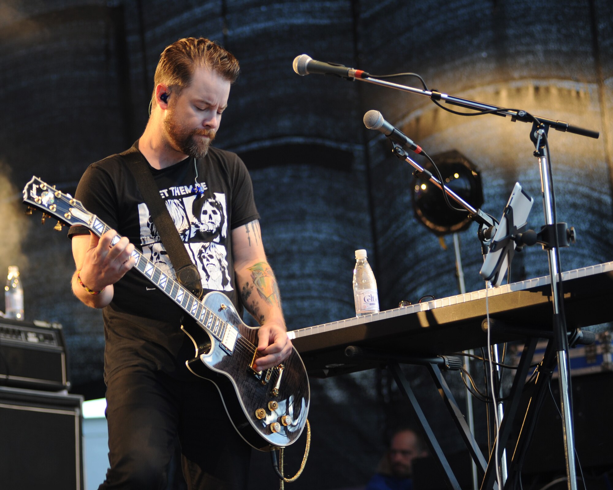 Musician David Cook plays his guitar during a 90 minute performance June 29, 2014, at Spangdahlem Air Base, Germany. Cook performed both original and cover songs as part of his first tour in Europe. (U.S. Air Force photo by Airman 1st Class Dylan Nuckolls/Released)