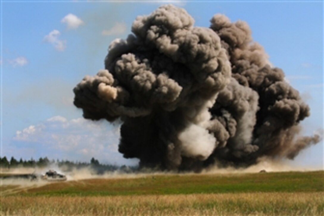 U.S. soldiers detonate a mine clearing line charge during a combined arms live-fire exercise at the Joint Multinational Readiness Center in Hohenfels, Germany, June 26, 2014. The soldiers, combat engineers, are assigned to the 1st Cavalry Division's Company B, 91st Brigade Engineer Battalion, 1st Brigade Combat Team.