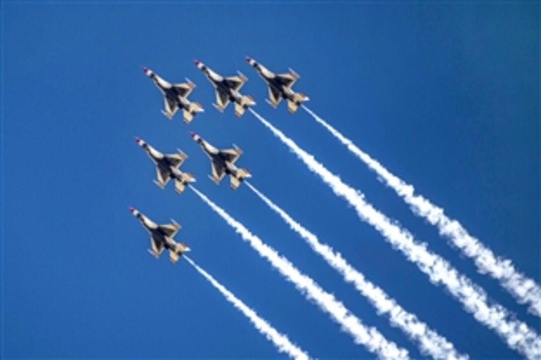 The U.S. Air Force Thunderbirds perform precision stunts during the Warriors Over the Wasatch Air Show on Hill Air Force Base, Utah, June 28, 2014. 