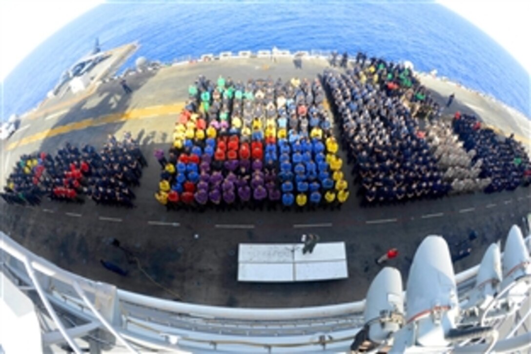 U.S. sailors and Marines participate ibn a safety stand down on the flight deck of the USS Bataan in the Mediterranean Sea, June 21, 2014. The Bataan, with elements of the 22nd Marine Expeditionary Unit, is operating in the U.S. 6th Fleet area of responsibility to augment U.S. crisis response forces in the region.