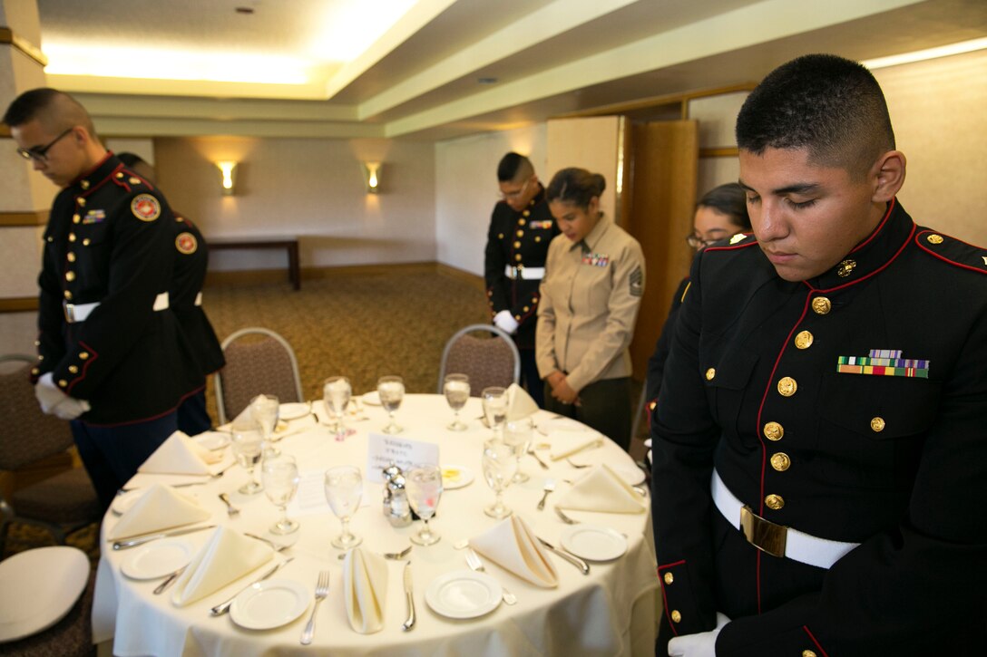 Marine Corps Junior Reserve Officer Training Corps cadets from Desert Hot Springs high school bow their heads in prayer during a Military Officers Association of America luncheon at Desert Springs Resort clubhouse in Palm Desert, Calif., Feb. 21. MOAA is made up of retired military officers from all different branches of service and plays an active role in military personnel matters and especially proposed legislation affecting the career force, the retired community, and veterans of the uniformed services. (Official Marine Corps Photo By Lance Cpl. Kasey Peacock/Released)


