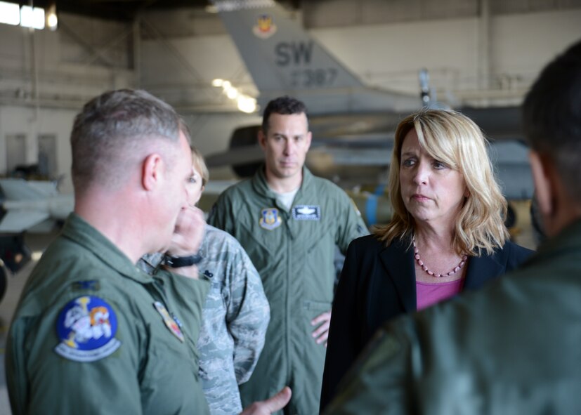 Secretary of the Air Force Deborah Lee James receives an F-16CJ Fighting Falcon capabilities brief from U.S. Air Force Col. Paul Murray, 20th Operations Group commander, during her visit to the 20th Fighter Wing at Shaw Air Force Base S.C., Feb. 27, 2014. Murray explained how the 21 munitions built, loaded and employed by the 20th FW support combatant commanders across the globe; one of James’ top priorities during her tenure. (U.S. Air Force photo by Tech. Sgt. Frank Miller/Released)
