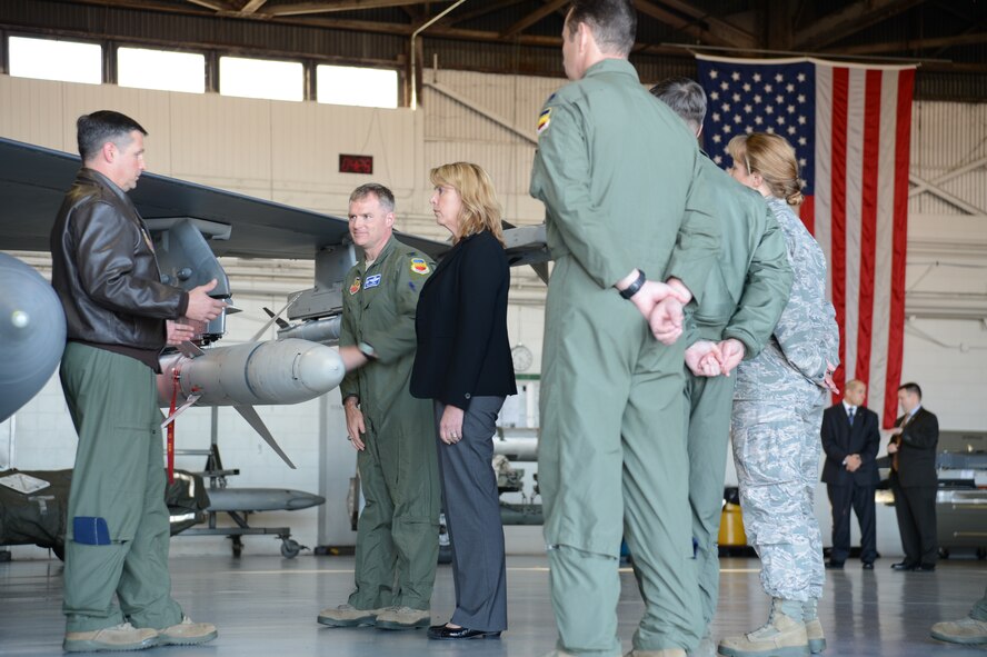 U.S. Air Force Col. Clay Hall, 20th Fighter Wing commander, explains to Secretary of the Air Force Deborah Lee James how the wing builds, loads and employs 21 munitions at Shaw Air Force Base, S.C., Feb. 27, 2014. James received F-16CJ Fighting Falcon aircraft and weapons capabilities briefings during her tour of the 20th Fighter Wing. (U.S. Air Force photo by Tech. Sgt. Frank Miller/Released)