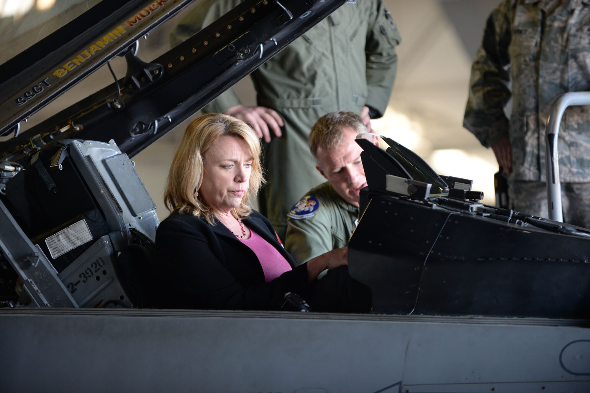 Secretary of the Air Force Deborah Lee James sits in the cockpit of an F-16CJ Fighting Falcon at Shaw Air Force Base, S.C., Feb. 27. 2014. U.S. Air Force Col. Paul Murray, 20th Operations Group commander, briefed James on the capabilities of the F-16 during the second stop of her three-base Air Combat Command immersion tour. (U.S. Air Force photo by Airman 1st Class Michael A. Cossaboom/Released)