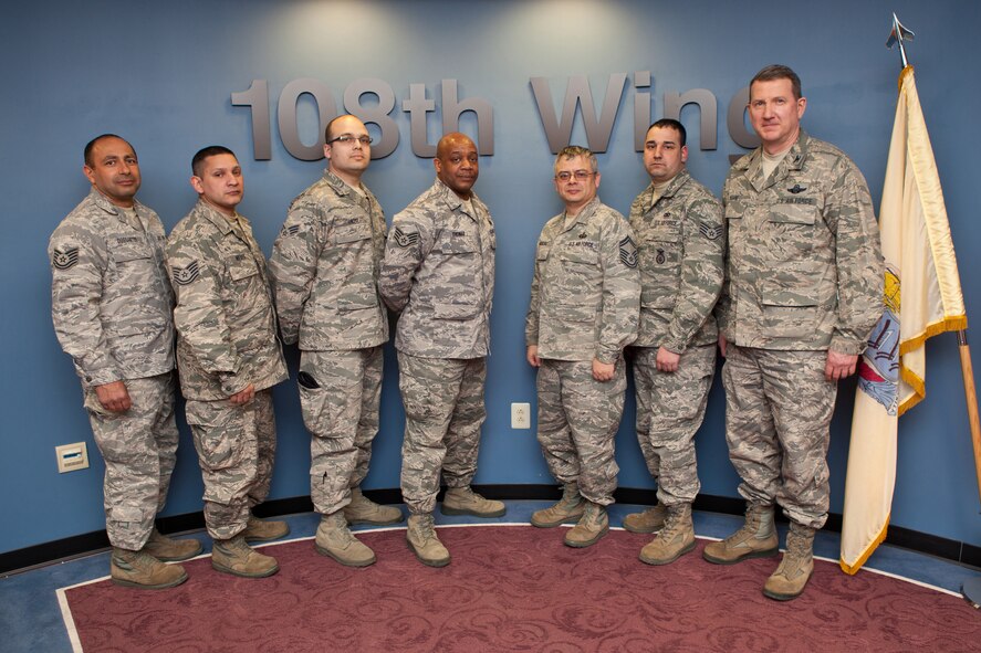 Airmen from the 108th Wing, New Jersey Air National Guard, re-enlist at a re-enlistment ceremony held at the Wing's conference room at Joint Base McGuire-Dix-Lakehurst, N.J., March 1, 2014. From left to right are Tech. Sgts. Sidney F. Dos Santos and Raymond Nieves, Senior Airman Richard L. Ortiz, Staff Sgt. Anthony Thomas, Senior Master Sgt. Victor G. Aguilera, Staff Sgt. Stephen J. Lisi and Col. Andy P. Keane, who conducted the oath of re-enlistment. (U.S. Air National Guard Photo by Master Sgt. Mark C. Olsen/Released)