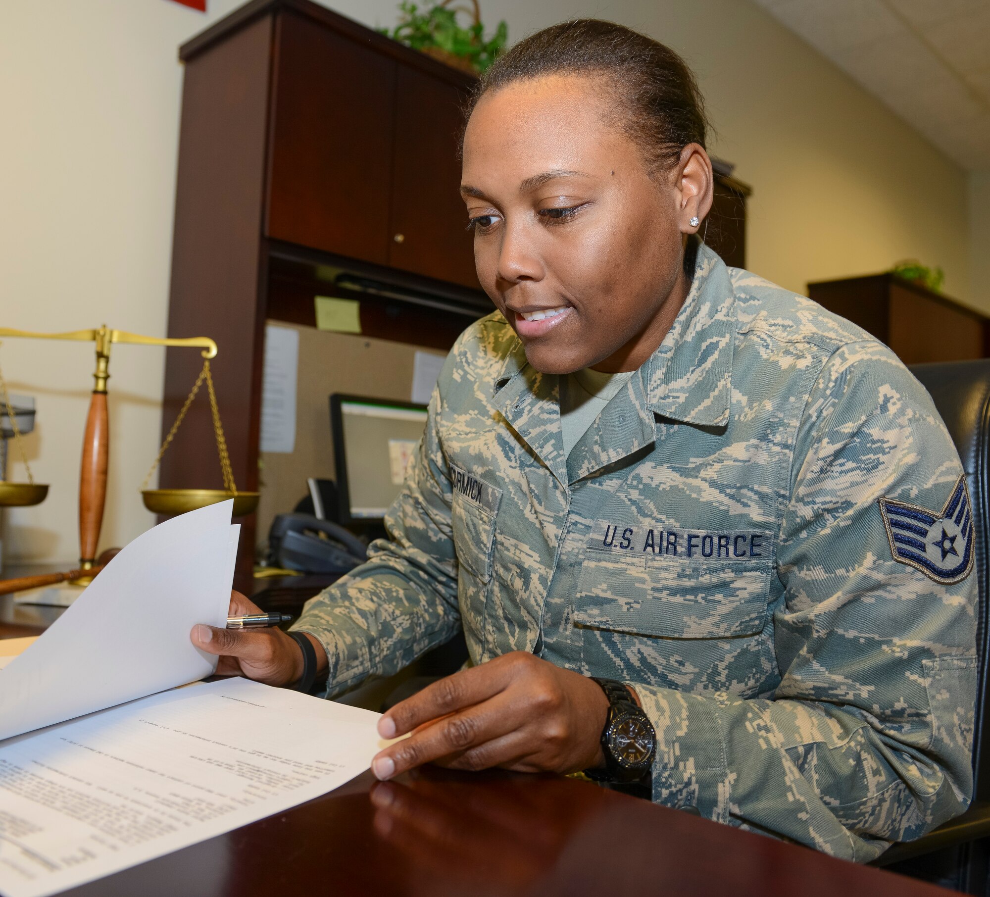 Air Force Staff Sgt. Barricia McCormick, a paralegal with the 116th Air Control Wing, Georgia Air National Guard, reviews legal cases during a drill weekend at Robins Air Force Base, Ga., Feb. 8, 2014. McCormick, who comes from a long line of family members who have served in the armed forces dating back to World War I, is related to Harriet Ross Tubman, the African-American abolitionist and humanitarian responsible for the rescue of more than 300 slaves through the Underground Railroad. (Georgia Air National Guard photo by Air Force Master Sgt. Roger Parsons)  