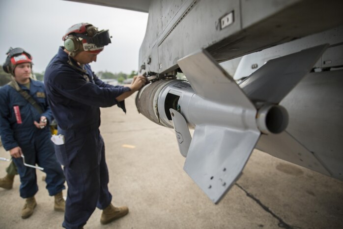 Lance Cpl. Casey Boatman performs a safety check on an MK-82 general purpose bomb after attaching it to an FA-18D Hornet aboard Wing One Royal Thai Air Force Base, Nakhon Ratchasima, Kingdom of Thailand, for a combined arms live fire training exercise Feb. 20 during Exercise Cobra Gold 2014. CG 14 is a joint, multinational exercise conducted annually in the Kingdom of Thailand aimed at enhancing and increasing multinational interoperability. Boatman is an ordnance technician with Marine All Weather Fighter Attack Squadron 242, Marine Aircraft Group 12, 1st Marine Aircraft Wing, III Marine Expeditionary Force. The FA-18D Hornet is with VMFA(AW)-242.