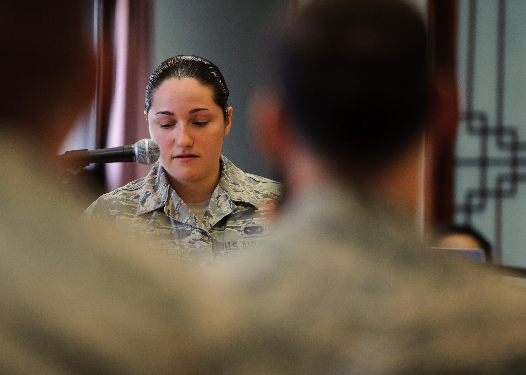 Staff Sgt. Tatiana Carbocci, 8th Security Forces Squadron military working dog handler, speaks about the lessons she learned from her time with military working dog Rico during his memorial service at Kunsan Air Base, Republic of Korea, Feb. 28, 2014. For more than nine years, Rico served the Wolf Pack as an explosive detection dog, ensuring the security of Kunsan. (U.S. Air Force photo by Senior Airman Armando A. Schwier-Morales/Released)