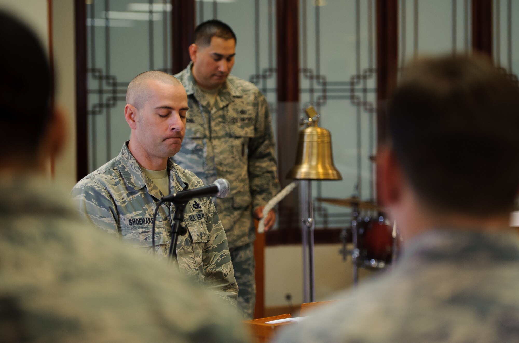 Master Sgt. Robert Shoemake, 8th Security Forces Squadron kennel master, pauses a moment after the ringing of the bell, signifying military working dog Rico’s passing, during his memorial ceremony at Kunsan Air Base, Republic of Korea, Feb. 28, 2014. For more than nine years, Rico served the Wolf Pack as an explosive detection dog, ensuring the security of Kunsan. (U.S. Air Force photo by Senior Airman Armando A. Schwier-Morales/Released)