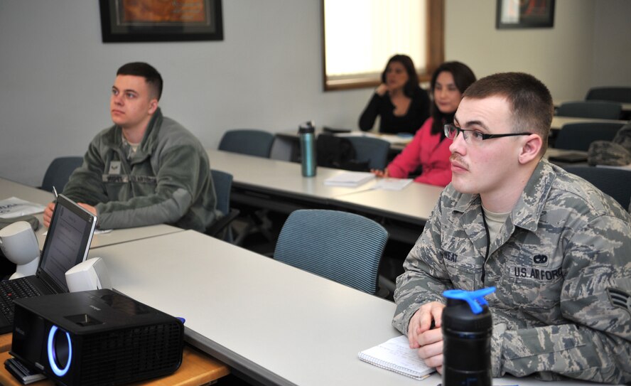 Participants in the Military Saves Week thrift savings plan and retirement class listen to Sun Park, Airman and Family Readiness Center community readiness consultant, explain the benefits of starting a TSP in the A&FRC classroom at Osan Air Base, Republic of Korea, Feb. 26, 2014. Military Saves Week is held every year during the last week of February at Air Force installations around the world and focuses on enhancing the financial knowledge of Airmen, their families and civilian employees. (U.S. Air Force photo/Airman 1st Class Ashley J. Thum)