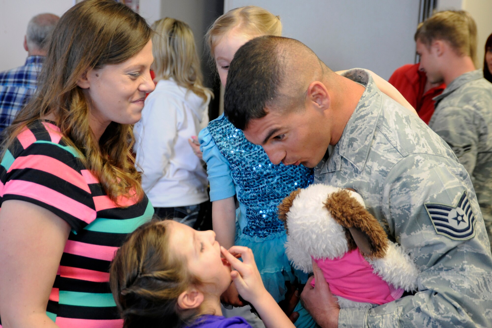 - Hailey Froese, daughter of TSgt Andrew and Jennifer Froese, shows her father where she lost a tooth during his six-month deployment to southwest Asia.  Approximately 30 127th Security Forces Airmen returned on March 2, 2014, at Selfridge Air National Guard Base, Mich. (U.S. Air National Guard photo by John S. Swanson / Released)