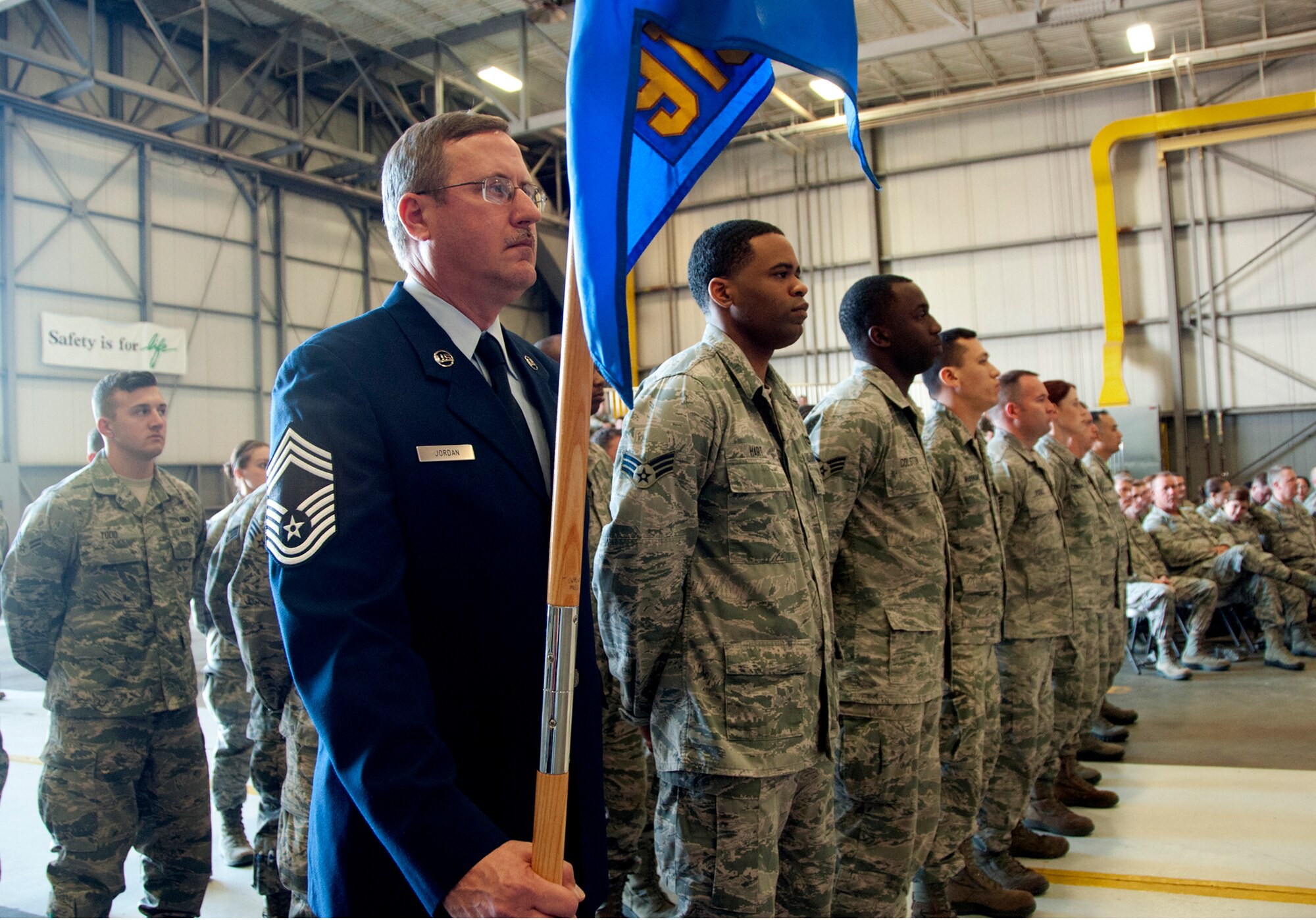 Chief Master Sgt. Leonard Jordan holds the guidon for the 919th Special Operations Mission Support Group formation during the assumption of command ceremony for Lt. Col. Brian Stahl March 1, at Duke Field, Fla. (U.S. Air Force photo/ Tech. Sgt. Cheryl Foster)